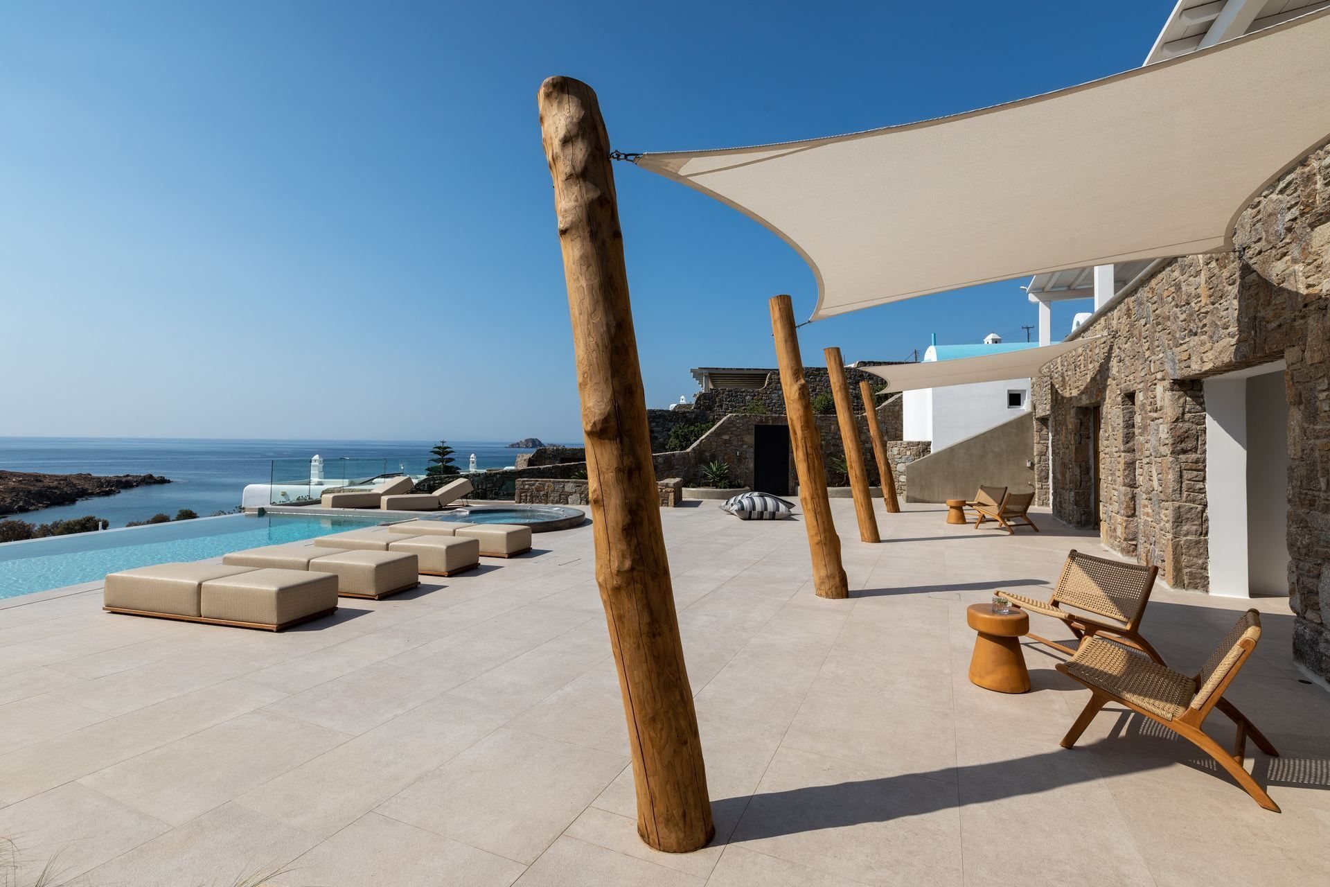 Mykonos villa terrace with sail shades and sea view